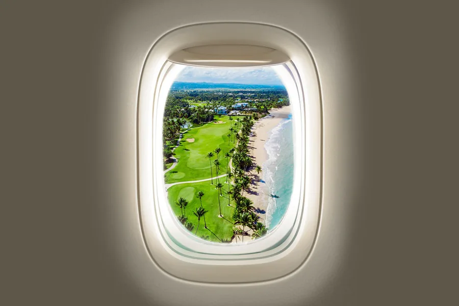 Tropical view from the window of St Barth Executive aircraft