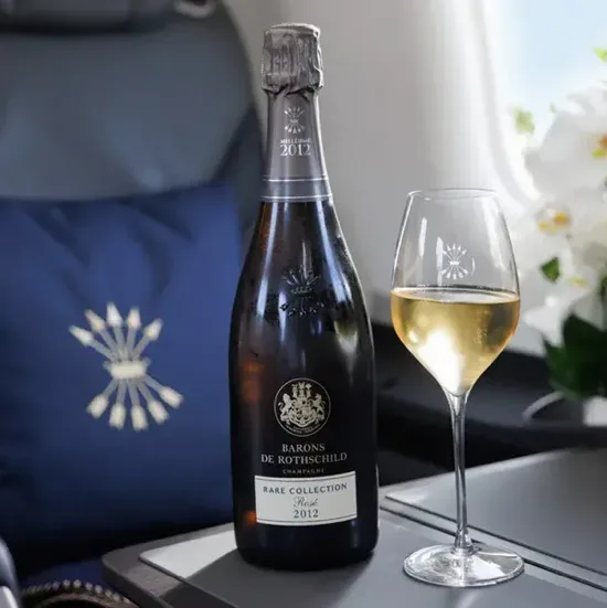 Champagne served inside a St Barth Executive Pilatus cabin